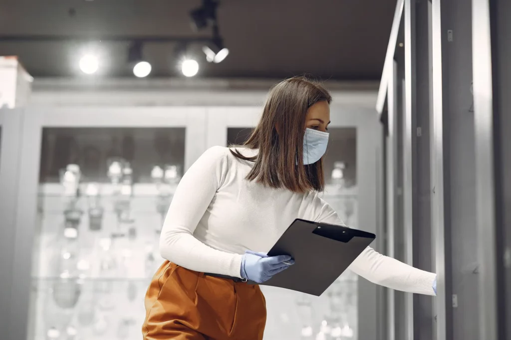 A woman taking manual readings for the reports required in the event of an AFSCA health inspection
